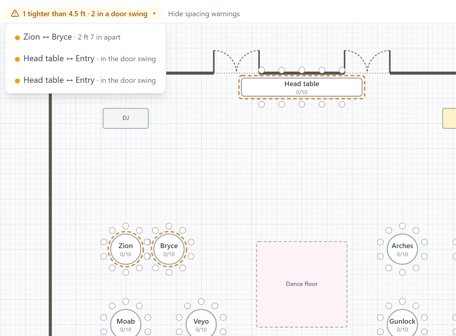 A ballroom floor plan with its doors drawn in, and a spacing warning naming the head table in the entry door swing.